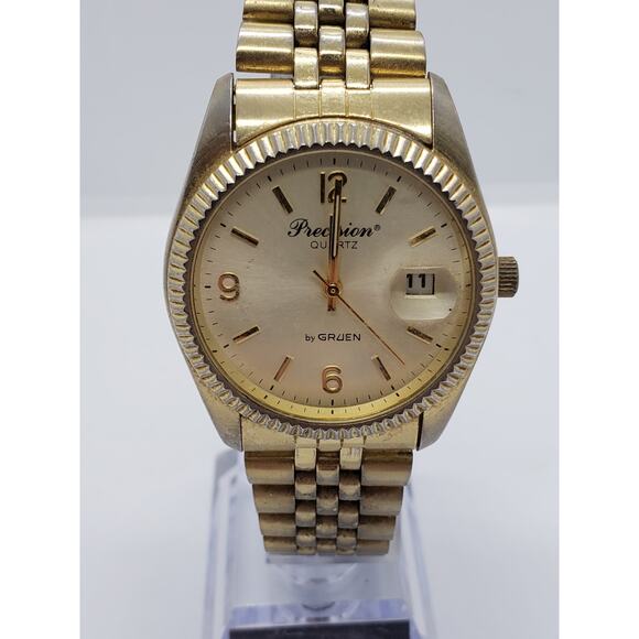 Precision Quartz by Gruen Men's watch. Gold face and band. GP5036, 098, PC32